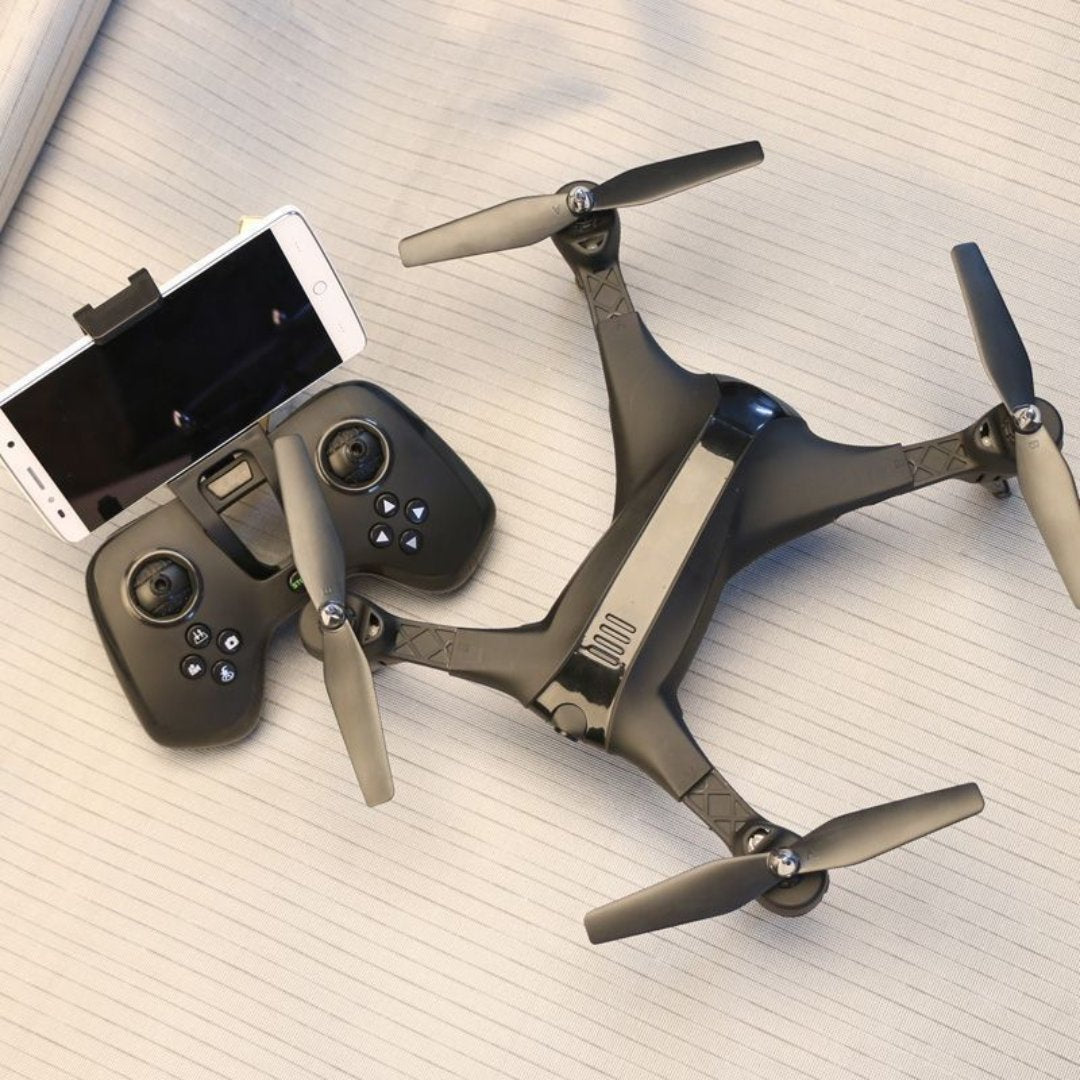 Folding drone with remote control, showcasing its compact design for easy portability